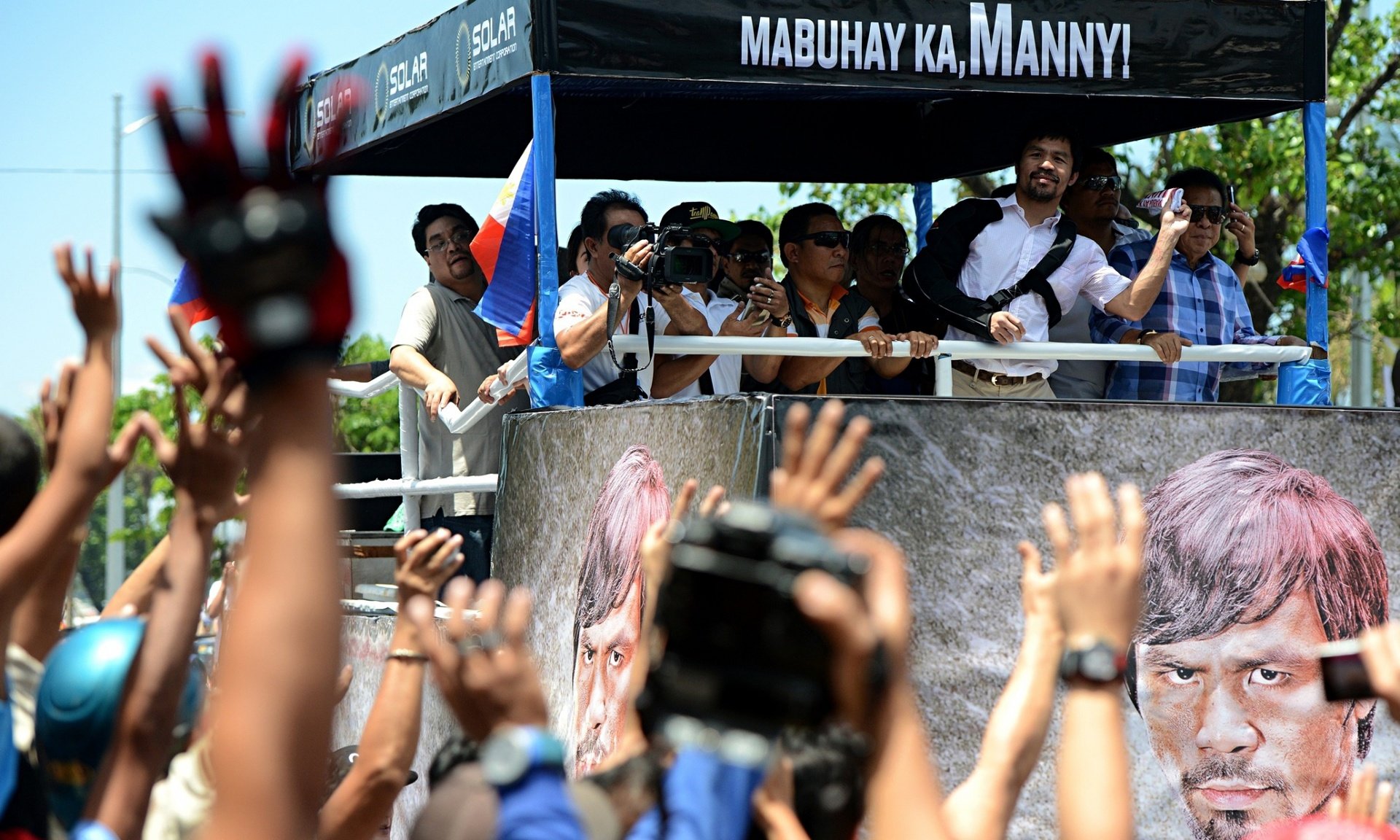 Crowds welcome defiant Manny Pacquiao on return to Philippines